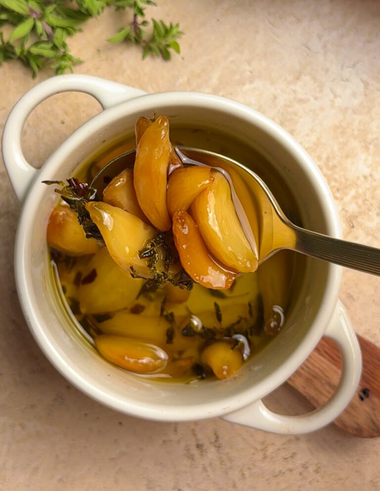 round baking dish, filled with roasted garlic. Spoon with garlic cloves.