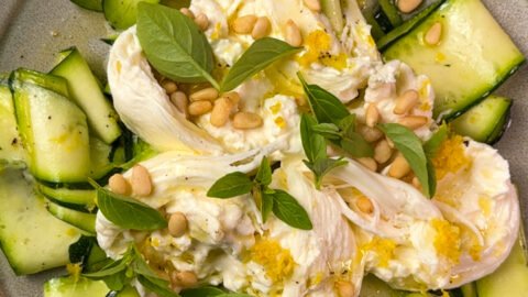 Zucchini salad on a grey plate.