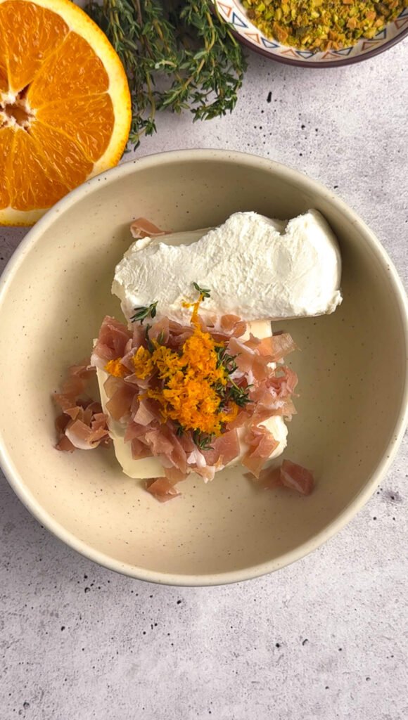 Goat cheese and cream cheese mixed with prosciutto, orange zest, and fresh thyme for cheese bonbons