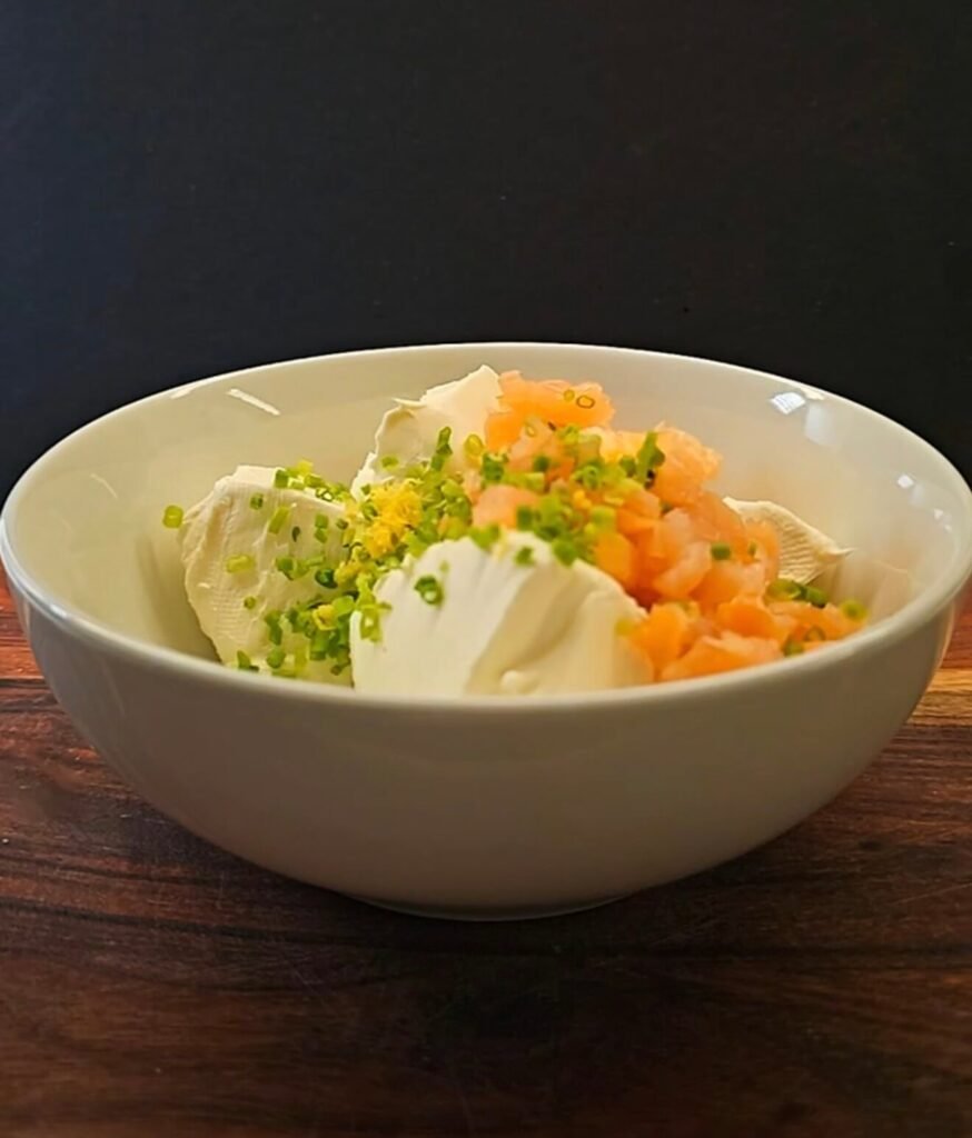 Cream cheese mixed with smoked salmon, chives, and lemon zest for savory cheesecake filling