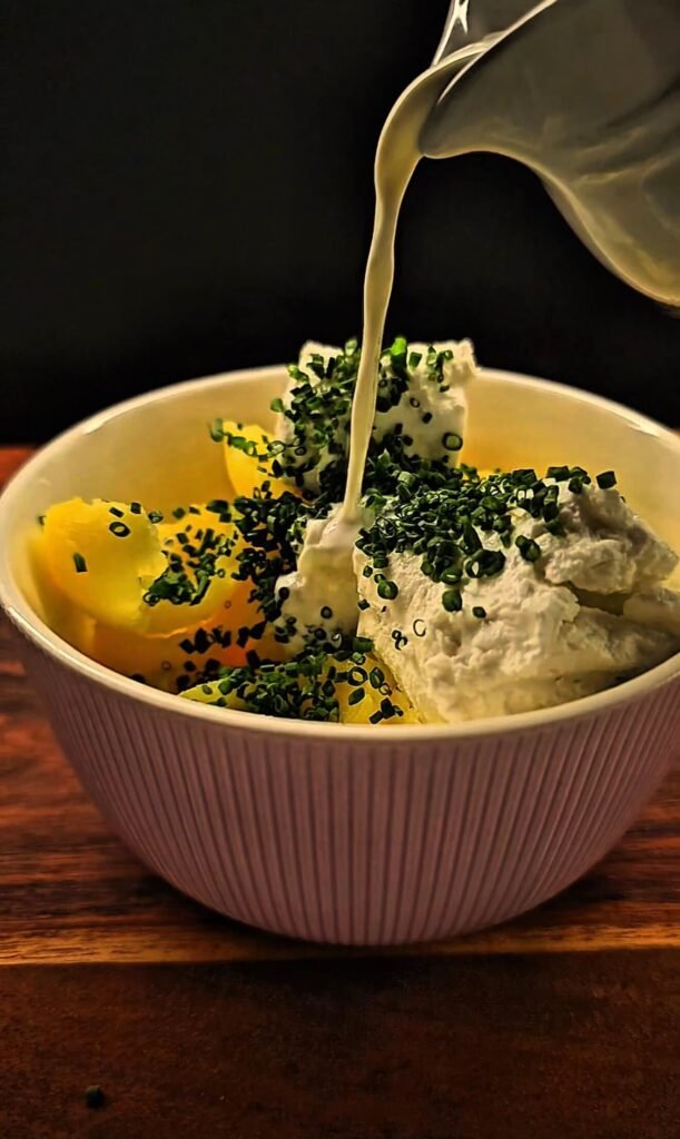 Mashed Yukon gold potatoes mixed with goat cheese, fresh chives, and half and half for twice-baked potatoes