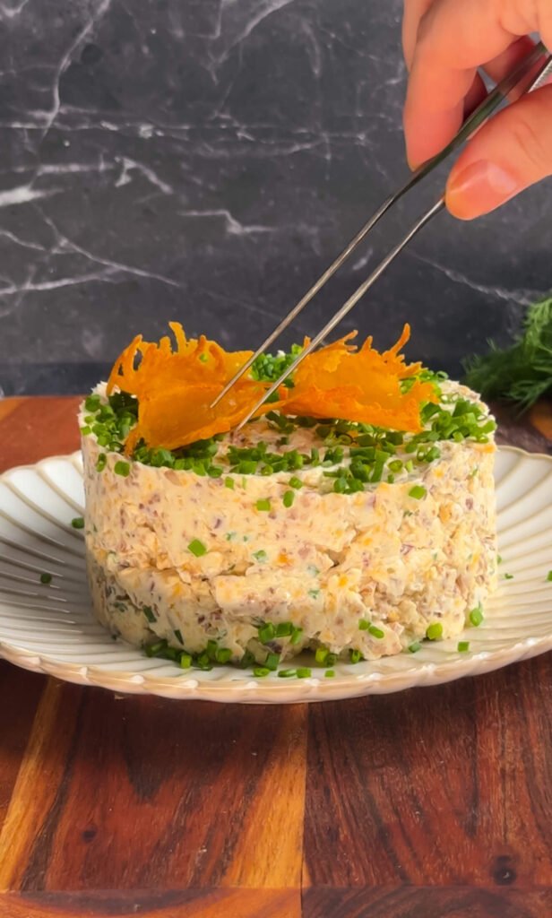 placing parmesan chips on cheese stack