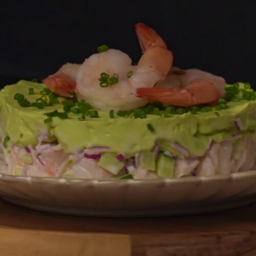 Creamy shrimp and avocado stack served as an elegant cold appetizer