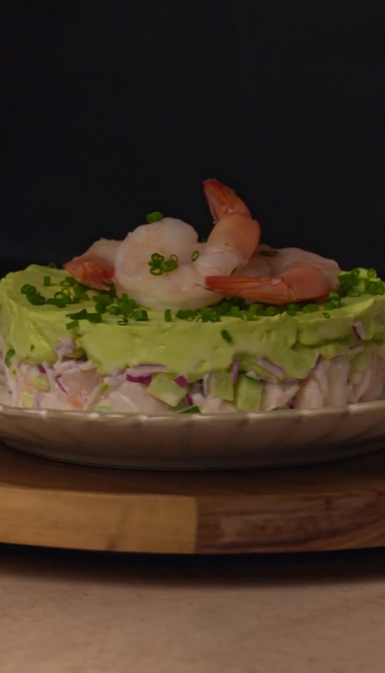 Creamy shrimp and avocado stack served as an elegant cold appetizer