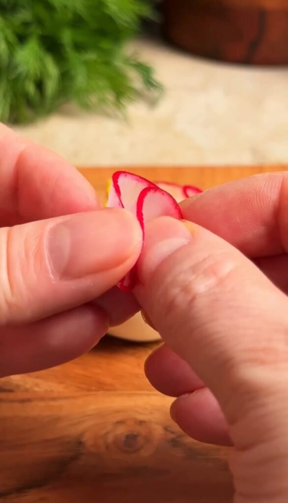 folded radish slices forming delicate petals for beautiful deviled eggs