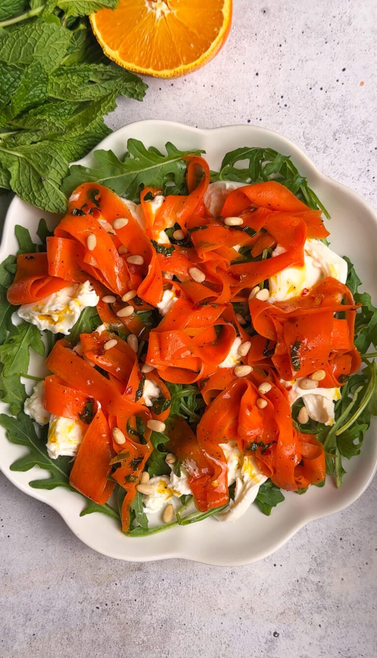 Roasted carrot burrata salad with arugula, toasted pine nuts, and citrus carrot glaze