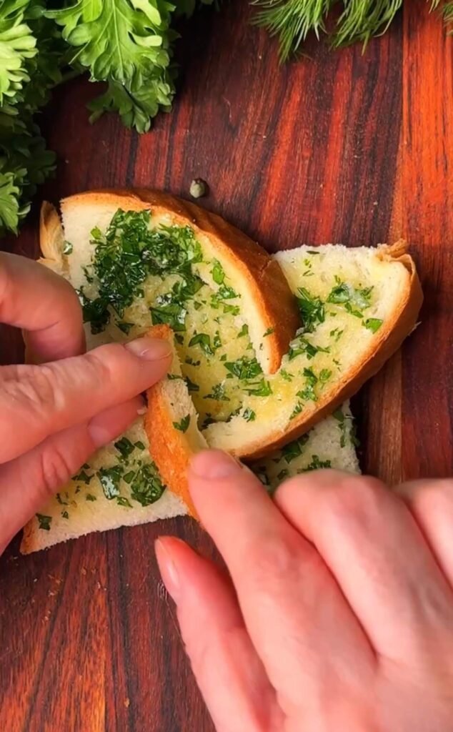 Shaping soft bread into a windmill pattern by gently folding cut sections inward to create a center well