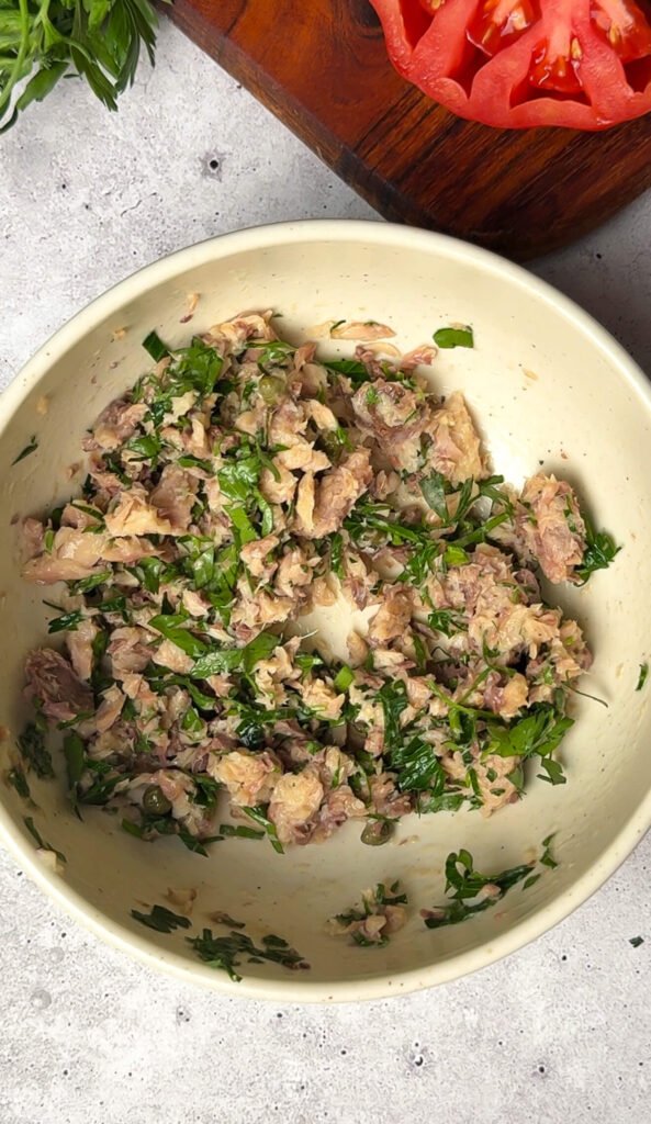 lemon herb sardine mixture with parsley and capers in bowl