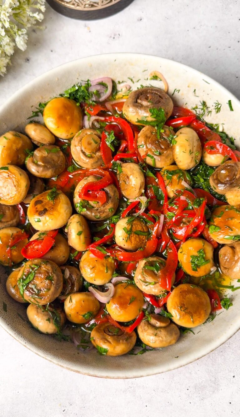 marinated mushroom salad with fresh herbs and red bell peppers in olive oil vinaigrette