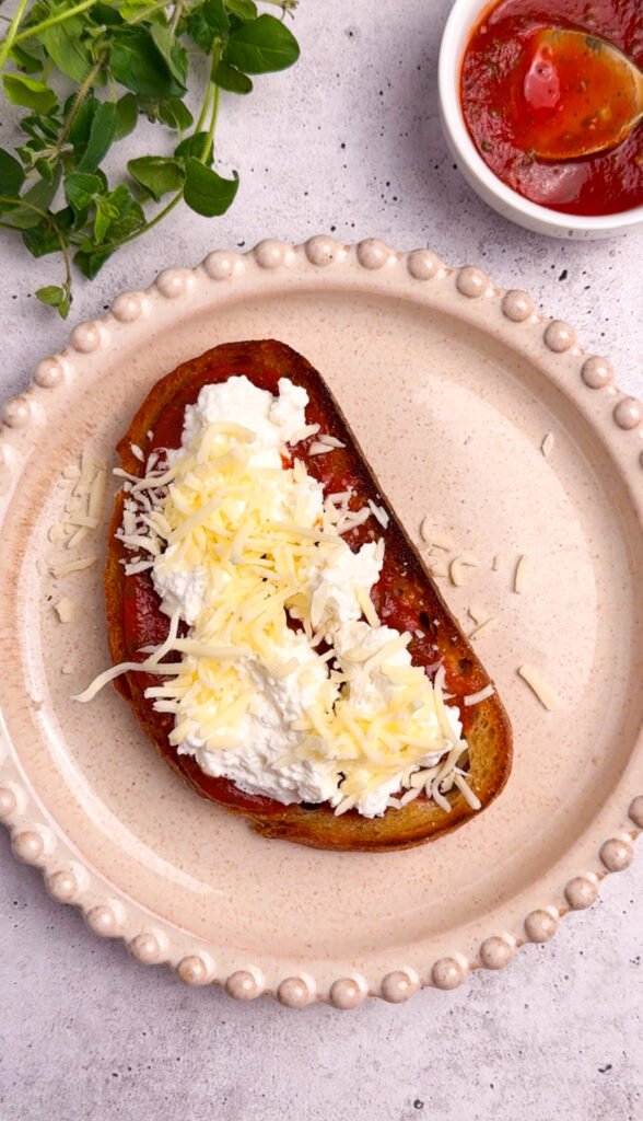 pizza toast with marinara cottage cheese and shredded mozzarella before baking
