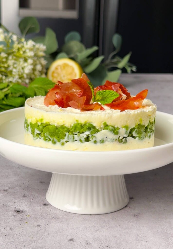 assembled ricotta pea timbale in ring mold with visible layered structure