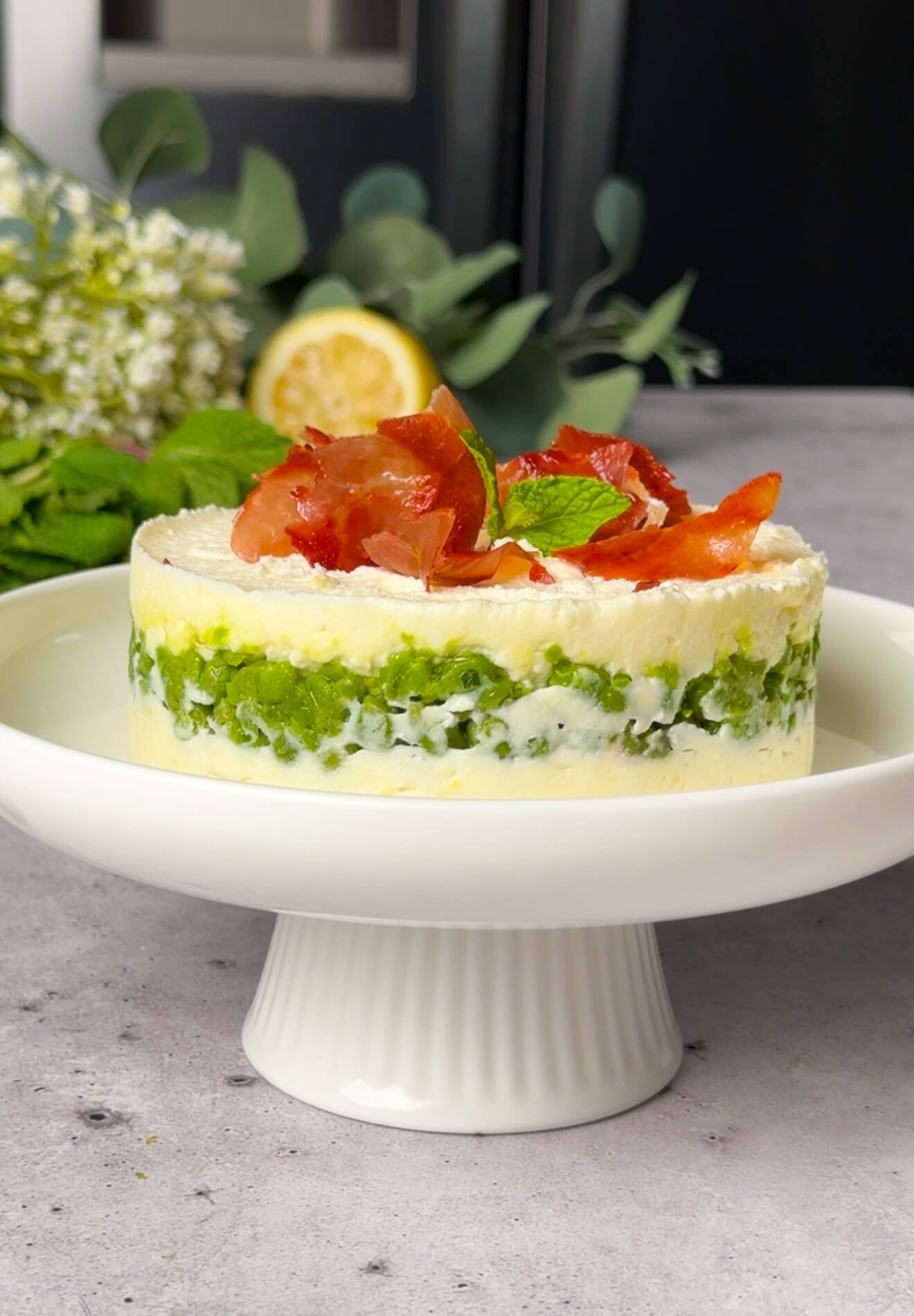 assembled ricotta pea timbale in ring mold with visible layered structure
