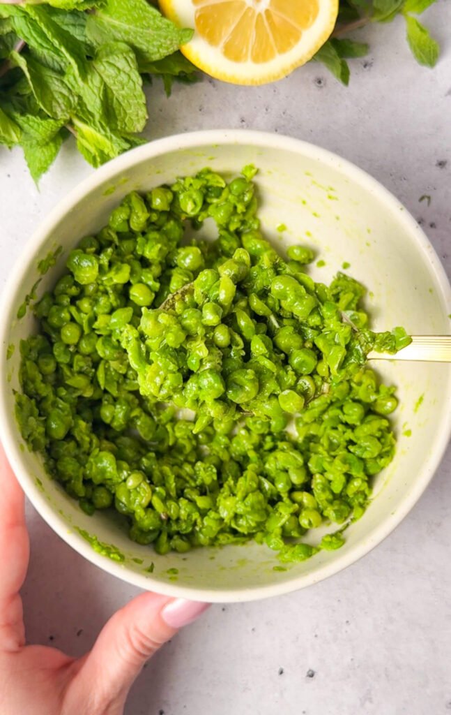 chunky pea mixture with mint and lemon for layered ricotta pea timbale