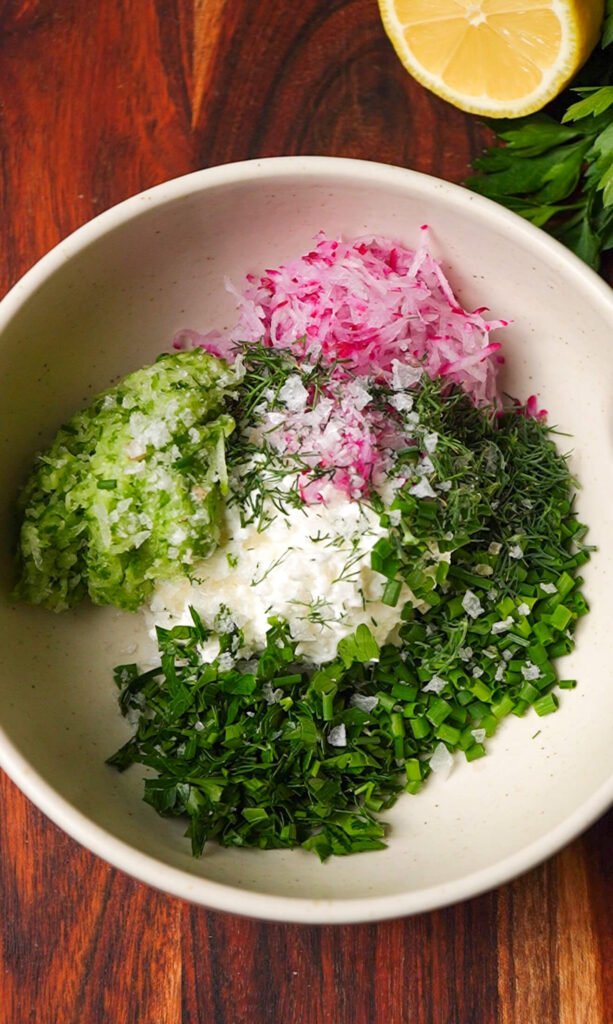 Cottage cheese mixed with grated cucumber, radish, and fresh herbs for spring garden toast