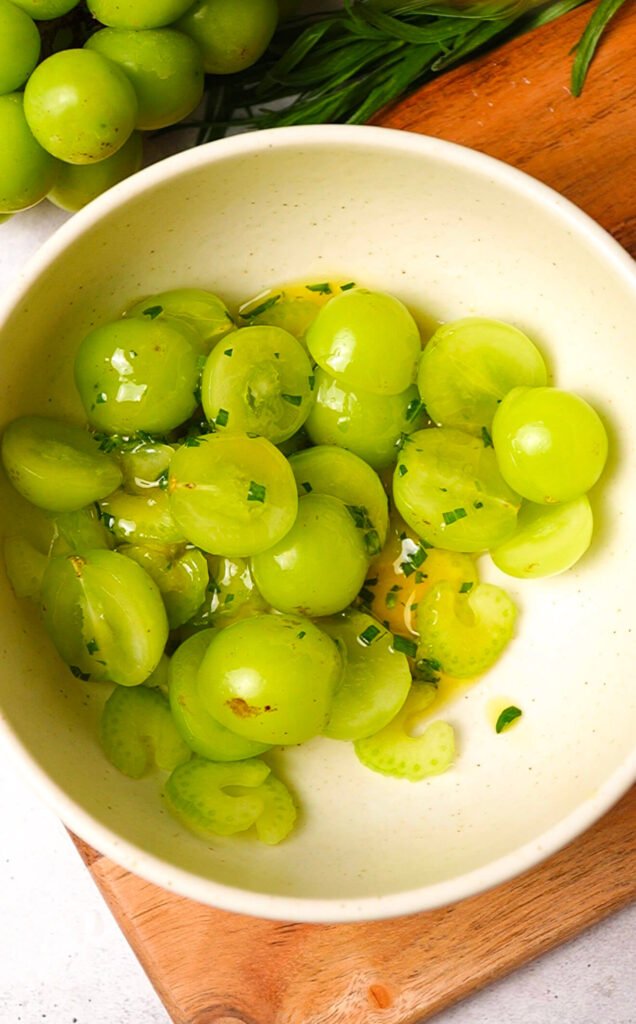 grapes and thinly sliced celery tossed in lemon dressing for waldorf salad with burrata