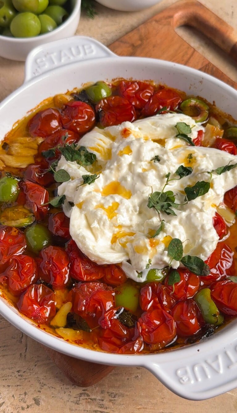 roasted tomato burrata with olives and fresh oregano in warm olive oil