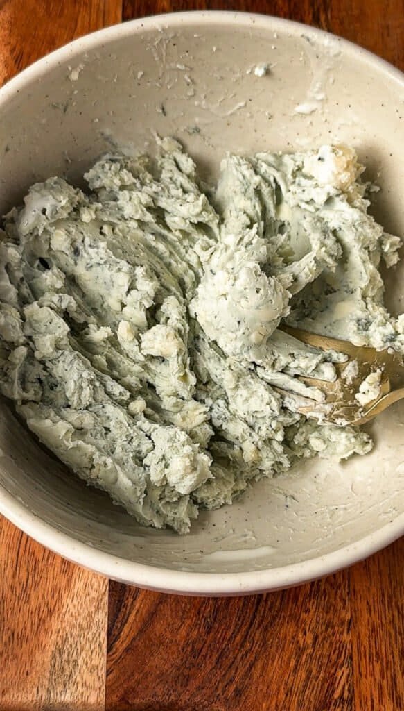 Gorgonzola cheese mashed with a fork until creamy but still textured