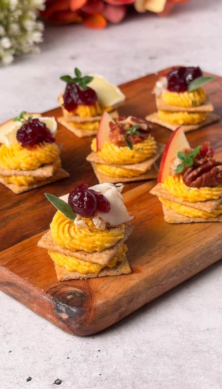 Butternut squash cheese crackers with cranberry, Brie, turkey, apple and pecan toppings
