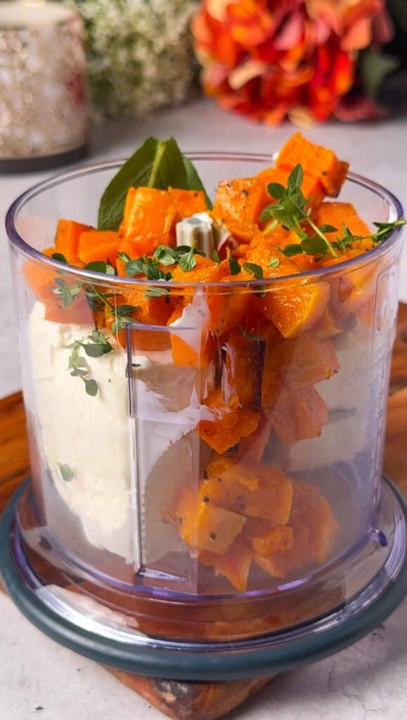 Roasted butternut squash, cream cheese, garlic and fresh herbs in a food processor