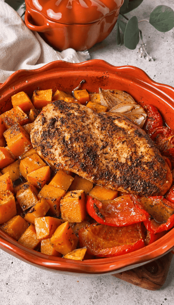 Seasoned roasted chicken breast with butternut squash, red pepper, tomatoes and shallot