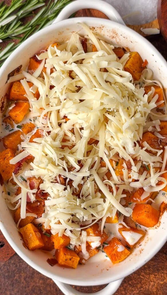 Roasted butternut squash with bacon, rosemary cream, and grated Gruyère before mixing